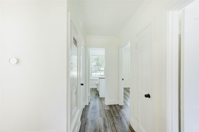 5326 Keystone St, Houston, TX 77021 - corridor with crown molding, wood finished floors, and baseboards