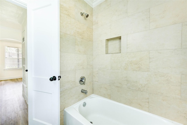5326 Keystone St, Houston, TX 77021 - bathroom featuring ornamental molding, wood finished floors, and shower / tub combination