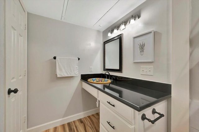 2120 El Paseo St Unit 2409, Houston, TX 77054 - bathroom with wood finished floors, baseboards, and vanity