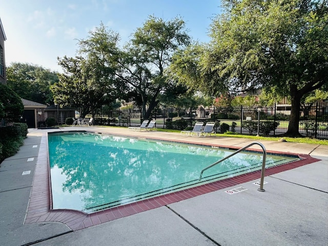 2121 El Paseo St Unit 1209, Houston, TX 77054 - community pool featuring a patio