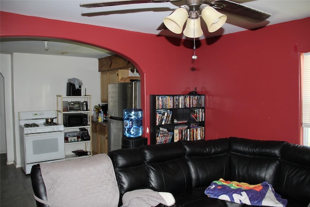 7615 Appleton St, Houston, TX 77022 - living area with arched walkways and ceiling fan