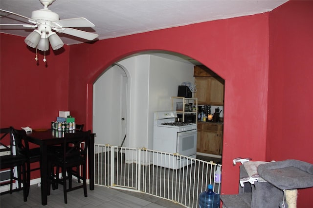 7615 Appleton St, Houston, TX 77022 - dining room featuring arched walkways, ceiling fan, and wood finished floors