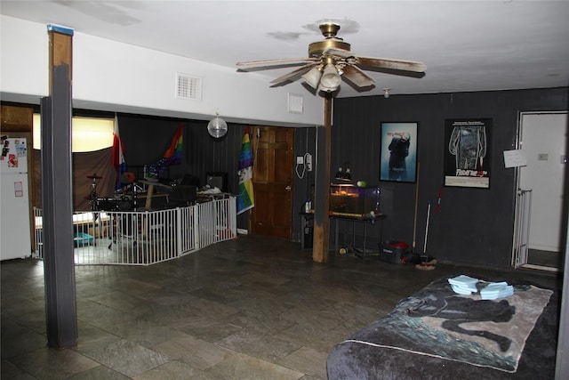 7615 Appleton St, Houston, TX 77022 - living area featuring a ceiling fan and stone finish floors