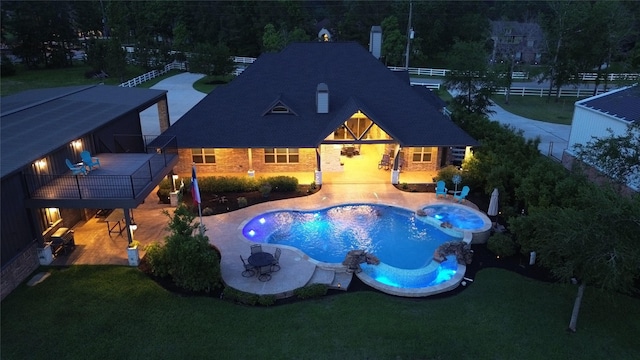 32710 Tall Oaks Way, Magnolia, TX 77354 - view of swimming pool featuring a pool with connected hot tub and a patio area