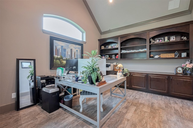 32710 Tall Oaks Way, Magnolia, TX 77354 - home office featuring crown molding, high vaulted ceiling, and light wood-style flooring
