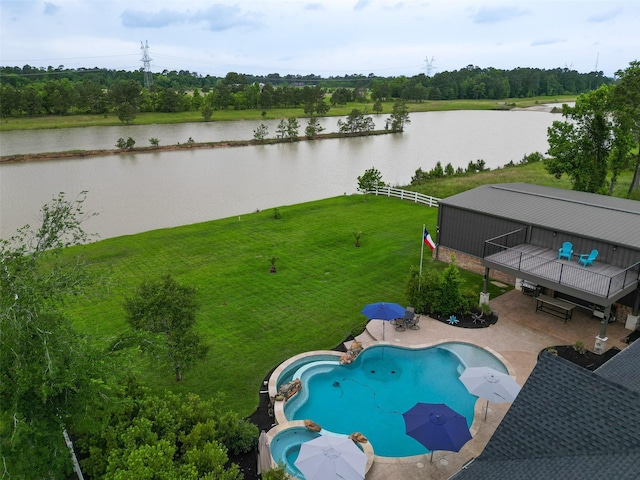 32710 Tall Oaks Way, Magnolia, TX 77354 - view of swimming pool featuring a patio area, a pool with connected hot tub, a deck with water view, and view of scattered trees