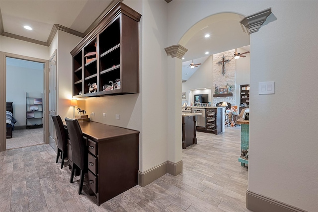 32710 Tall Oaks Way, Magnolia, TX 77354 - office featuring ceiling fan, arched walkways, light wood-style floors, lofted ceiling, and recessed lighting