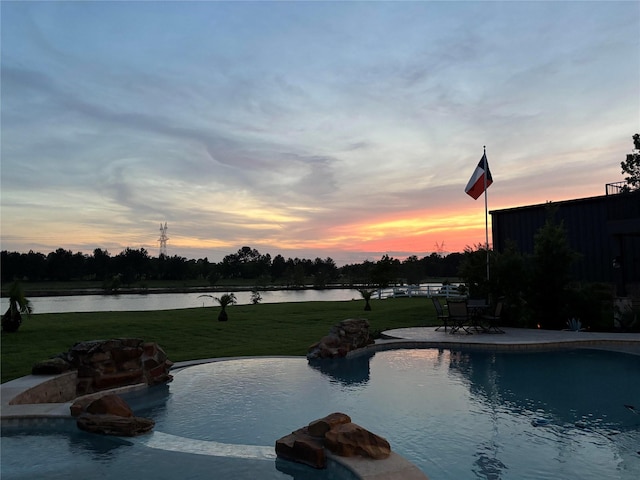 32710 Tall Oaks Way, Magnolia, TX 77354 - pool at dusk with a yard and a water view