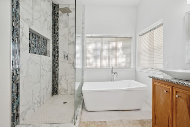 10323 Otter Cir, Baytown, TX 77523 - full bath featuring a freestanding bath, a stall shower, vanity, and tile patterned flooring