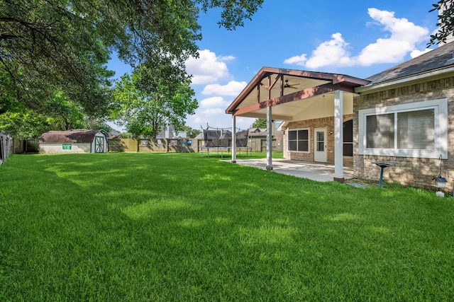 10323 Otter Cir, Baytown, TX 77523 - view of yard with a patio, ceiling fan, and a trampoline
