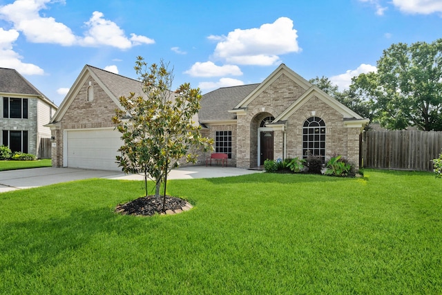 10323 Otter Cir, Baytown, TX 77523 - view of front of property with brick siding, driveway, roof with shingles, and a garage