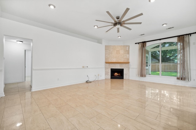 10323 Otter Cir, Baytown, TX 77523 - unfurnished living room with a ceiling fan, a lit fireplace, recessed lighting, and baseboards