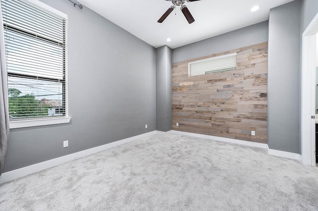 24 N N Hutcheson St, Houston, TX 77003 - carpeted empty room with wooden walls, plenty of natural light, a ceiling fan, baseboards, and recessed lighting