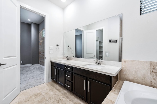 24 N N Hutcheson St, Houston, TX 77003 - bathroom featuring double vanity, a bathtub, and tile patterned flooring