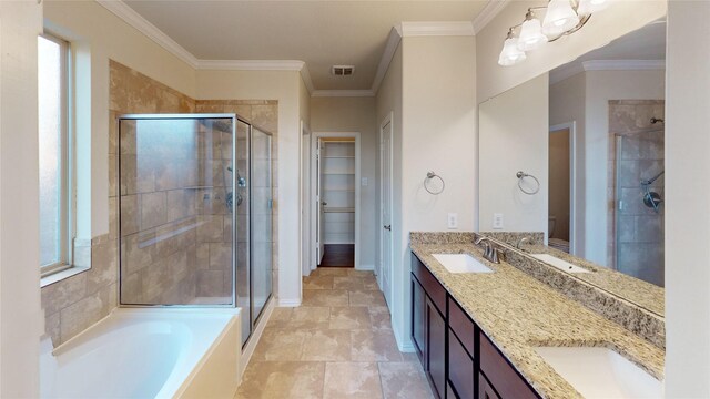 24129 Auburn Falls Ln, Porter, TX 77365 - bathroom featuring a stall shower, double vanity, a garden tub, and ornamental molding