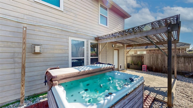 24129 Auburn Falls Ln, Porter, TX 77365 - wooden deck featuring a hot tub, a pergola, and a patio