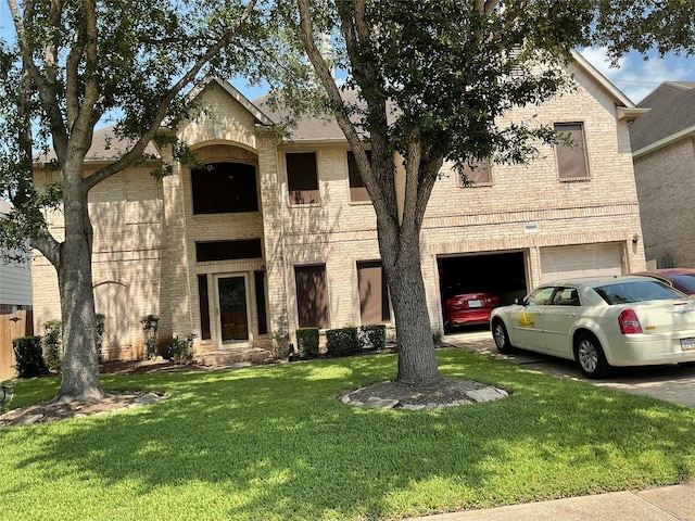 3035 Aspen Hollow Ln, Sugar Land, TX 77479 - view of front of house with brick siding, a garage, a front yard, and driveway