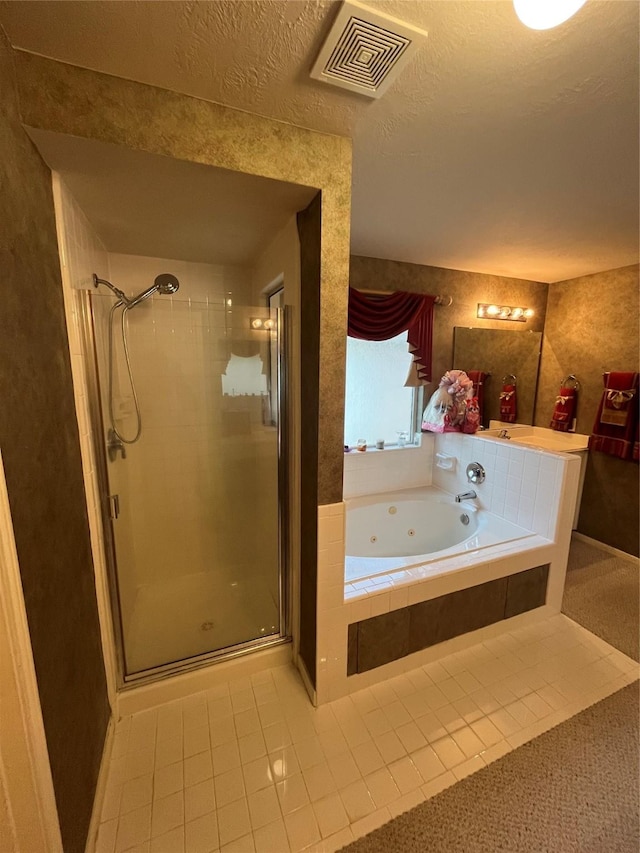 3035 Aspen Hollow Ln, Sugar Land, TX 77479 - full bathroom featuring tile patterned flooring, a stall shower, a jetted tub, and a textured ceiling