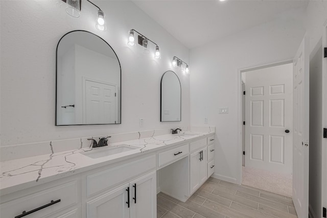 9212 Arvin St, Houston, TX 77028 - full bathroom featuring double vanity, wood finish floors, and baseboards