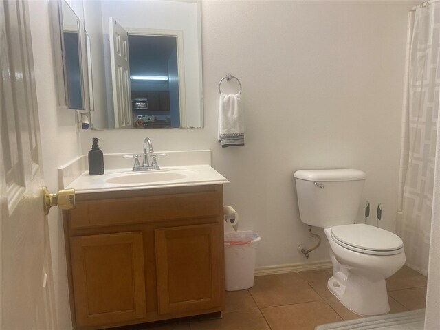 19042 Yaupon Ranch Dr, Cypress, TX 77433 - bathroom with tile patterned flooring, vanity, toilet, baseboards, and a shower with shower curtain