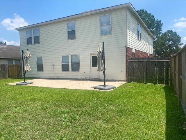 19042 Yaupon Ranch Dr, Cypress, TX 77433 - back of property with a patio area