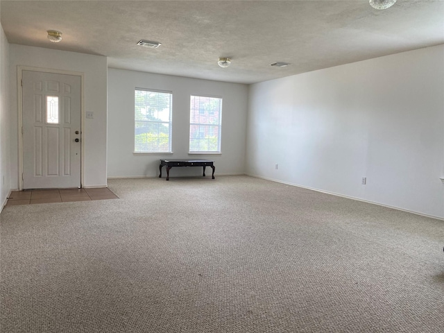 19042 Yaupon Ranch Dr, Cypress, TX 77433 - foyer entrance with carpet and baseboards