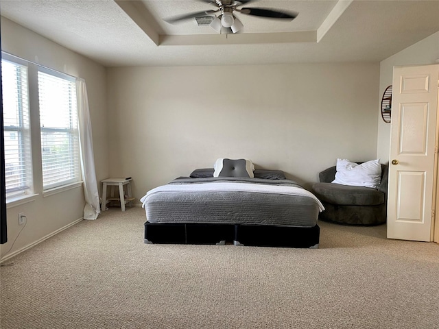 19042 Yaupon Ranch Dr, Cypress, TX 77433 - carpeted bedroom with a raised ceiling and a ceiling fan