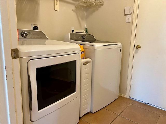 19042 Yaupon Ranch Dr, Cypress, TX 77433 - laundry area featuring separate washer and dryer and light tile patterned floors