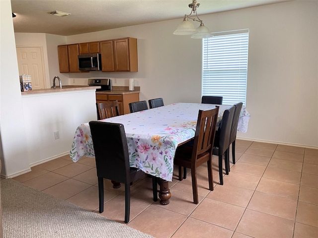 19042 Yaupon Ranch Dr, Cypress, TX 77433 - dining room with light tile patterned floors and baseboards