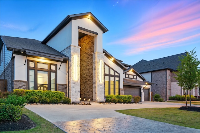 18011 Brazos River Cir, Cypress, TX 77433 - contemporary house featuring driveway, stucco siding, brick siding, and stone siding