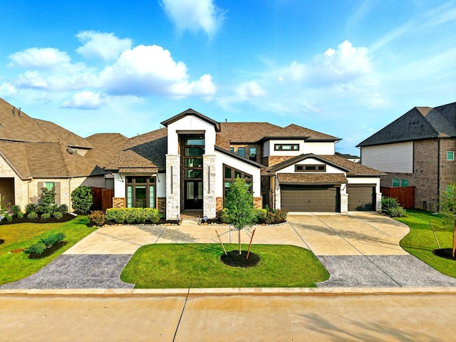 18011 Brazos River Cir, Cypress, TX 77433 - view of front facade with an attached garage, concrete driveway, and stone siding