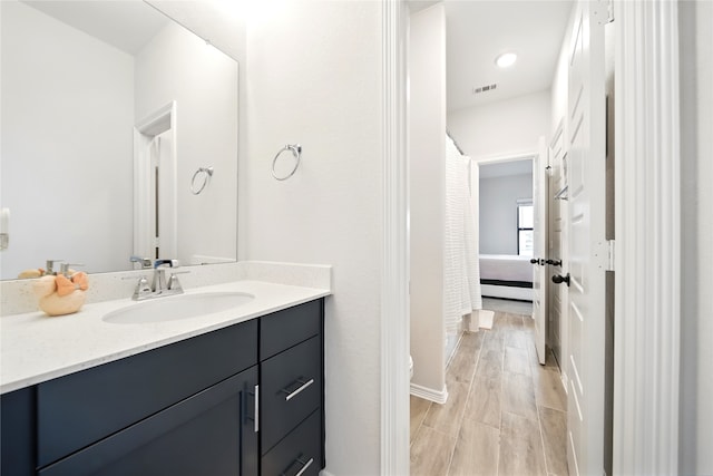 18011 Brazos River Cir, Cypress, TX 77433 - full bath featuring vanity, toilet, wood finished floors, and ensuite bath
