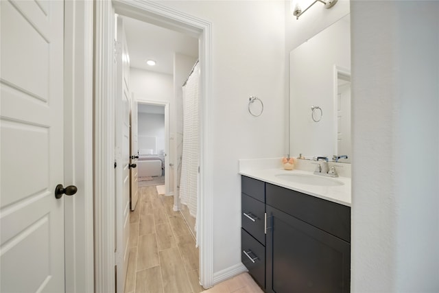 18011 Brazos River Cir, Cypress, TX 77433 - full bath with vanity, baseboards, wood finished floors, and recessed lighting