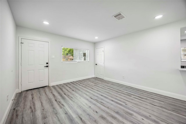 5751 Belmark St, Houston, TX 77033 - unfurnished room featuring wood finished floors, baseboards, and recessed lighting