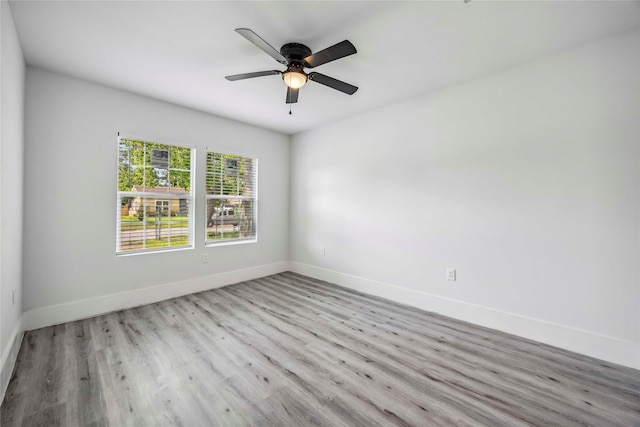 5751 Belmark St, Houston, TX 77033 - unfurnished room featuring baseboards, wood finished floors, and ceiling fan