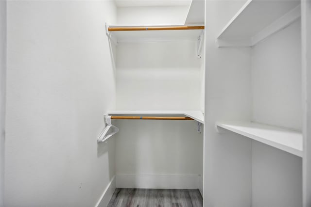 5751 Belmark St, Houston, TX 77033 - spacious closet featuring wood finished floors