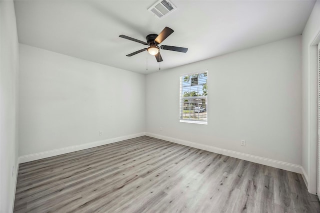 5751 Belmark St, Houston, TX 77033 - spare room with wood finished floors, baseboards, and a ceiling fan