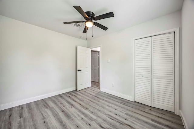 5751 Belmark St, Houston, TX 77033 - unfurnished bedroom featuring light wood-style flooring, baseboards, a closet, and a ceiling fan