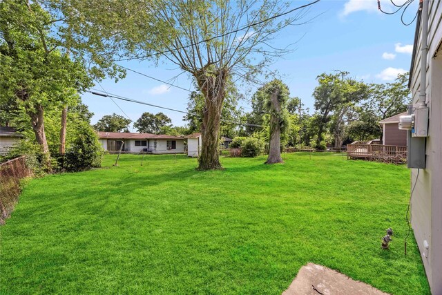 5751 Belmark St, Houston, TX 77033 - view of yard featuring a wooden deck