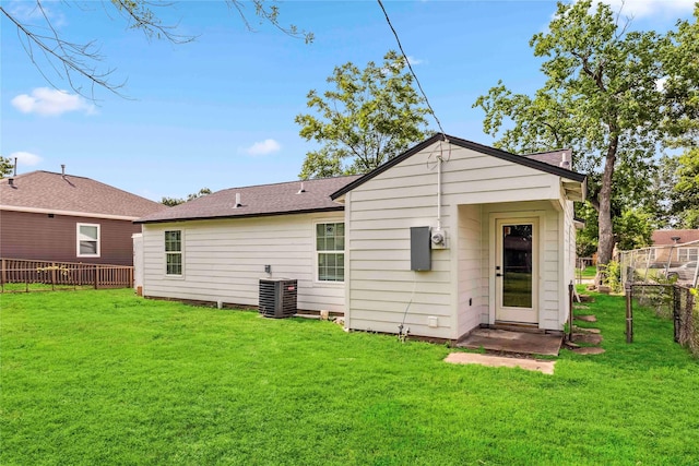 5751 Belmark St, Houston, TX 77033 - rear view of property featuring central air condition unit and roof with shingles