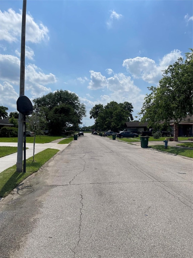8630 Flossie Mae St, Houston, TX 77029 - view of asphalt street featuring sidewalks