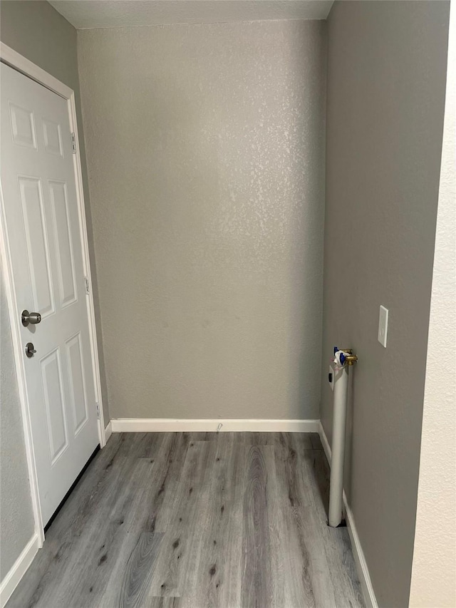 8630 Flossie Mae St, Houston, TX 77029 - spare room featuring wood finished floors and baseboards
