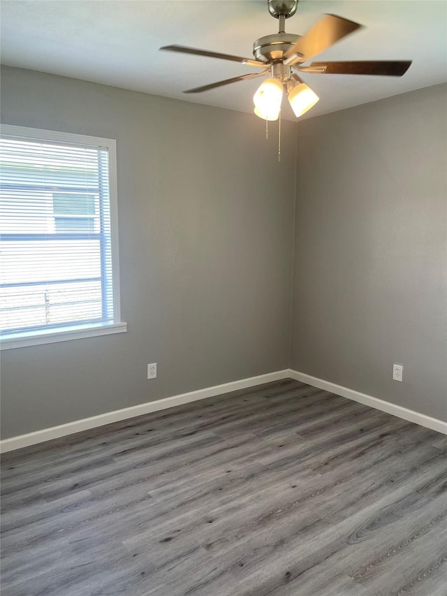 8630 Flossie Mae St, Houston, TX 77029 - spare room featuring wood finished floors, ceiling fan, and baseboards