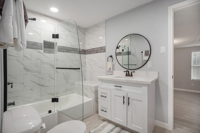 7449 Walker St, Houston, TX 77011 - full bath with toilet, bath / shower combo with glass door, baseboards, vanity, and recessed lighting