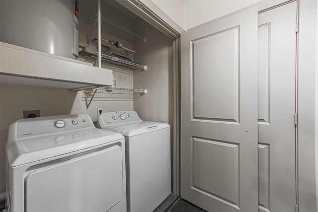 1901 Post Oak Blvd Unit 3115, Houston, TX 77056 - washroom with washing machine and clothes dryer