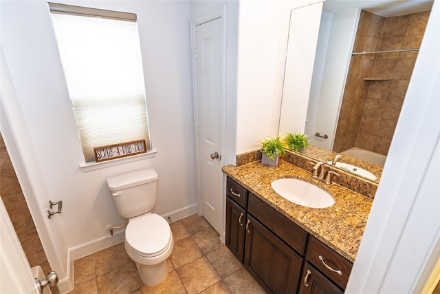 1306 Malone St, Houston, TX 77007 - full bathroom with vanity, toilet, baseboards, and tile patterned flooring