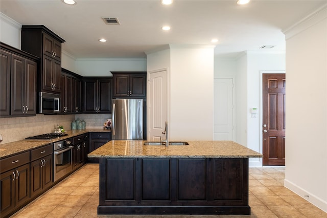 1306 Malone St, Houston, TX 77007 - kitchen featuring appliances with stainless steel finishes, a sink, light tile patterned flooring, light stone countertops, and backsplash
