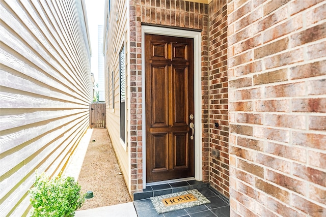 1306 Malone St, Houston, TX 77007 - view of exterior entry with brick siding and a gate