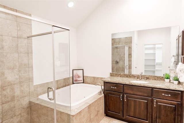 1306 Malone St, Houston, TX 77007 - full bath with a shower stall, vanity, a bath, lofted ceiling, and a walk in closet