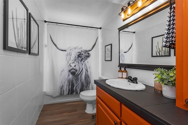 1137 Jones Rd, New Waverly, TX 77358 - bathroom with vanity, a shower with curtain, wood finished floors, and toilet